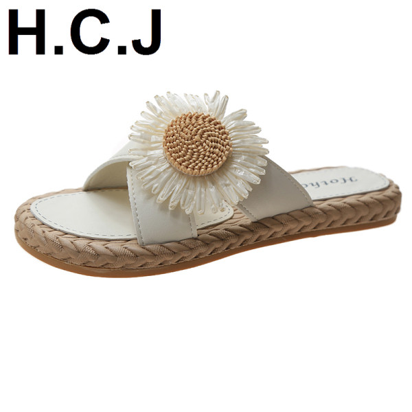 Papuci de damă cu talpă plată și element cu flori