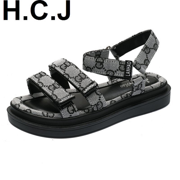 Modernas sieviešu sandales ar plakanu augsto zoli