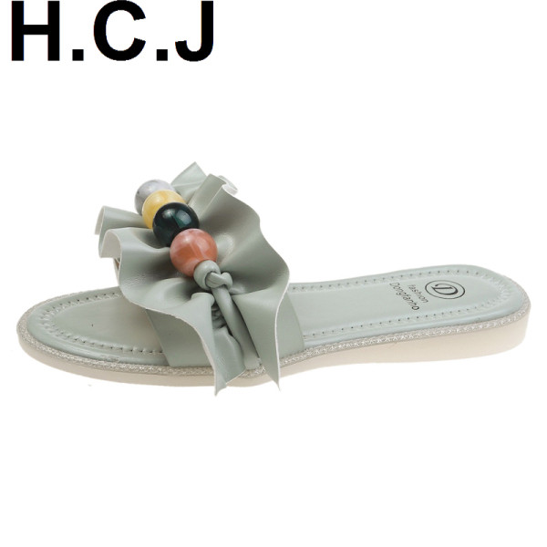 Papuci de damă cu talpă plată și un element - pietre colorate