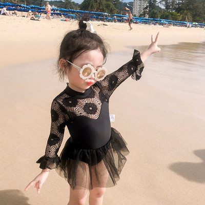 Children`s full swimsuit for girls with lace sleeves and tulle