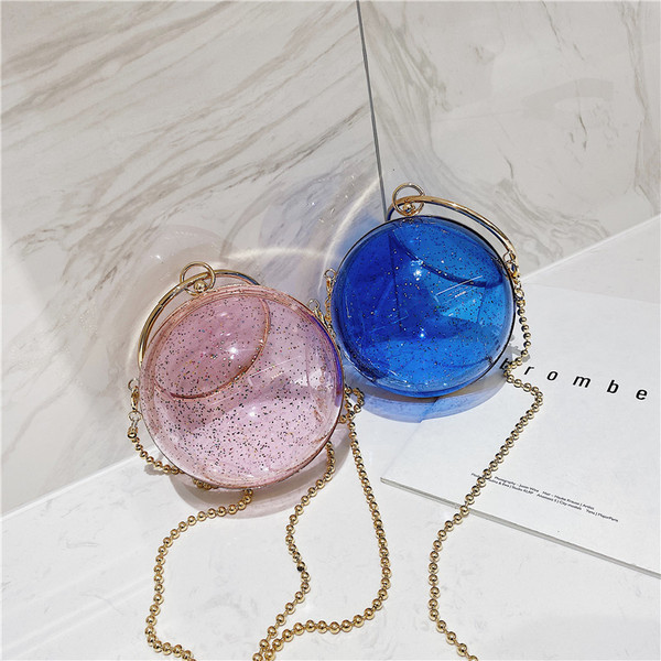 Naiste moodne ümmargune pika metallist käepidemega kott