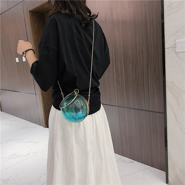 Naiste moodne ümmargune pika metallist käepidemega kott