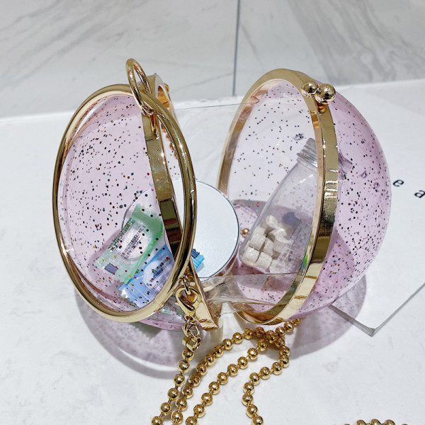 Naiste moodne ümmargune pika metallist käepidemega kott