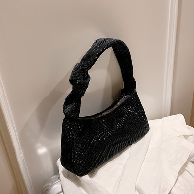 Moodne tõmbluku ja aasadega naiste kott