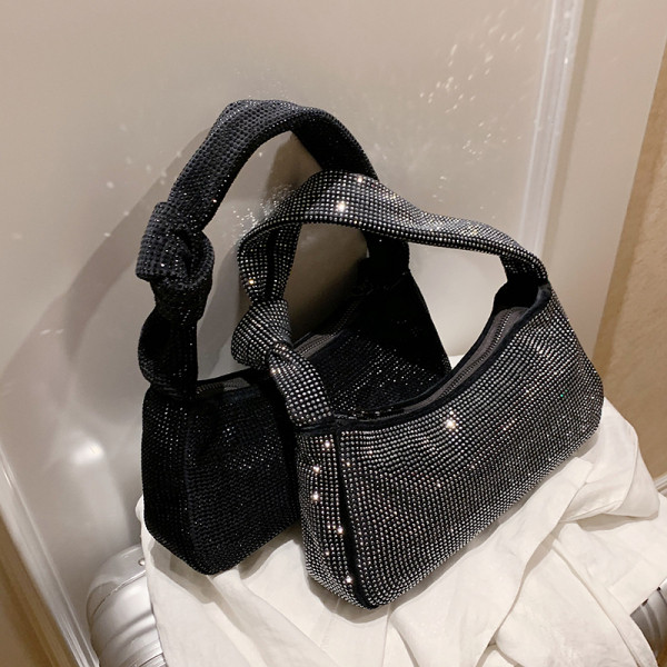 Moodne tõmbluku ja aasadega naiste kott