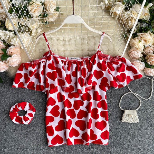 Moderna sieviešu blūze ar krītošām piedurknēm un apdruku