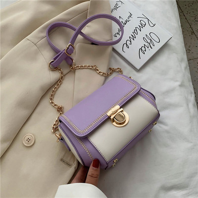 Κομψή γυναικεία τσάντα με μεταλλικά στοιχεία και μακριά λαβή