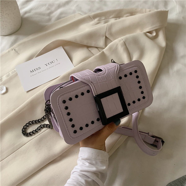 Geanta de dama moderna din piele ecologica cu ochiuri si catarama