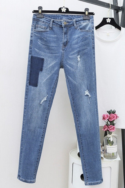 Moodne naiste teksapükstega mudel kõrge vöökohaga ja suurustega kuni 5XL