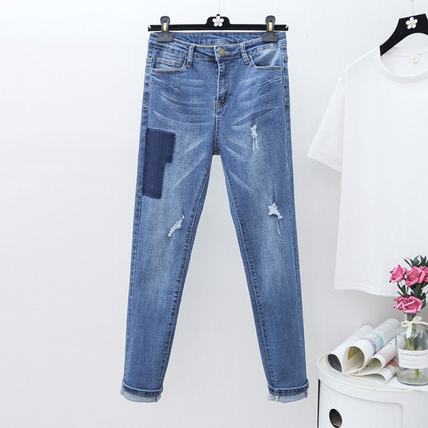 Moodne naiste teksapükstega mudel kõrge vöökohaga ja suurustega kuni 5XL