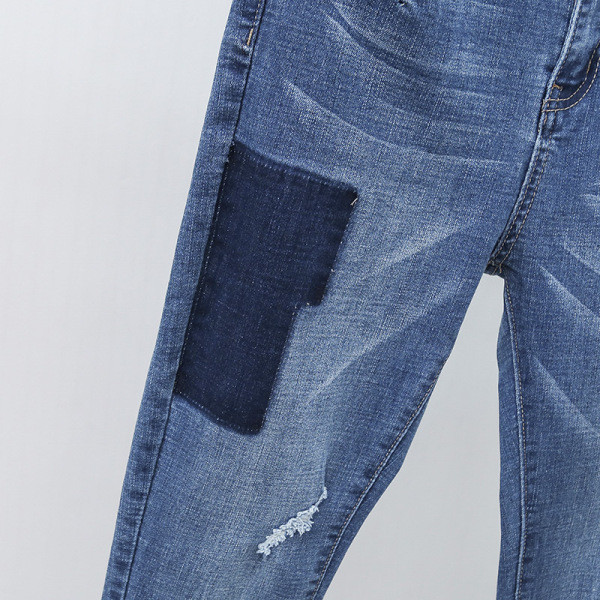 Moodne naiste teksapükstega mudel kõrge vöökohaga ja suurustega kuni 5XL