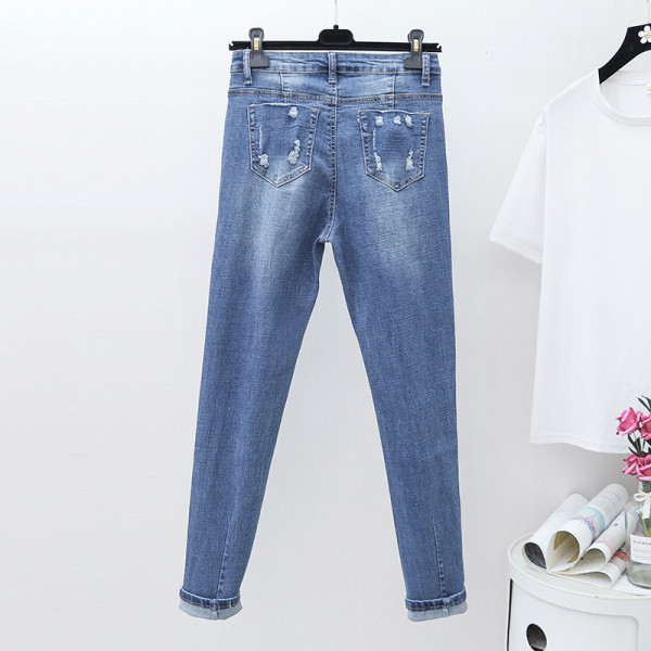 Moodne naiste teksapükstega mudel kõrge vöökohaga ja suurustega kuni 5XL