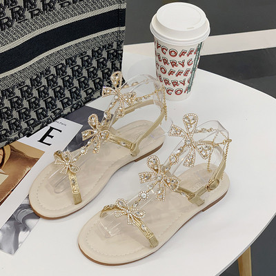 Sandale de damă elegante, cu talpă plată și un element-pietre