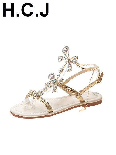 Sandale de damă elegante, cu talpă plată și un element-pietre