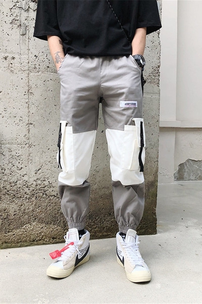 Pantaloni largi de bărbați cu buzunare și inscripție