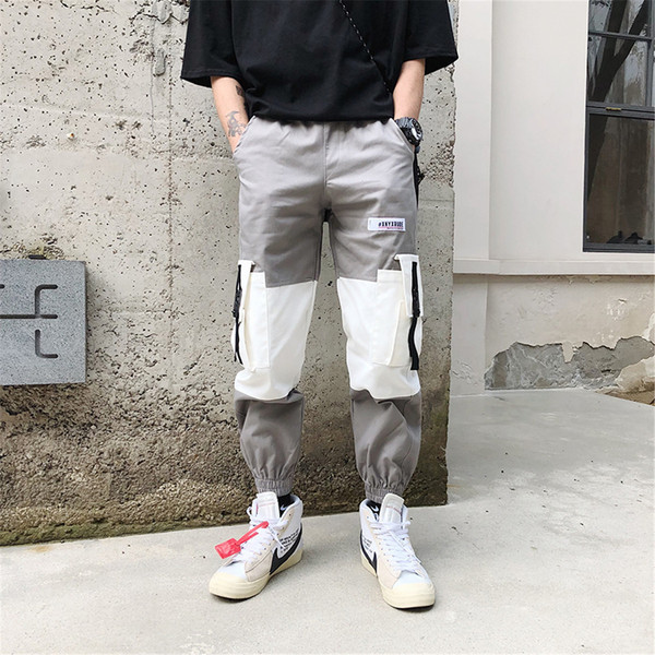 Pantaloni largi de bărbați cu buzunare și inscripție