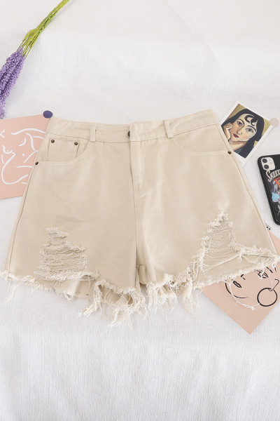 Moodsad kõrge vöökoha ja rebenenud motiividega lühikesed teksad