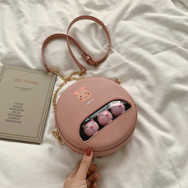 Igapäevane ümara kuju ja aplikatsiooniga naistekott