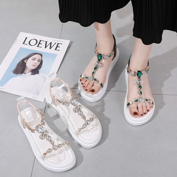 Modernas sieviešu sandales ar augstām zolēm un krāsainiem akmeņiem