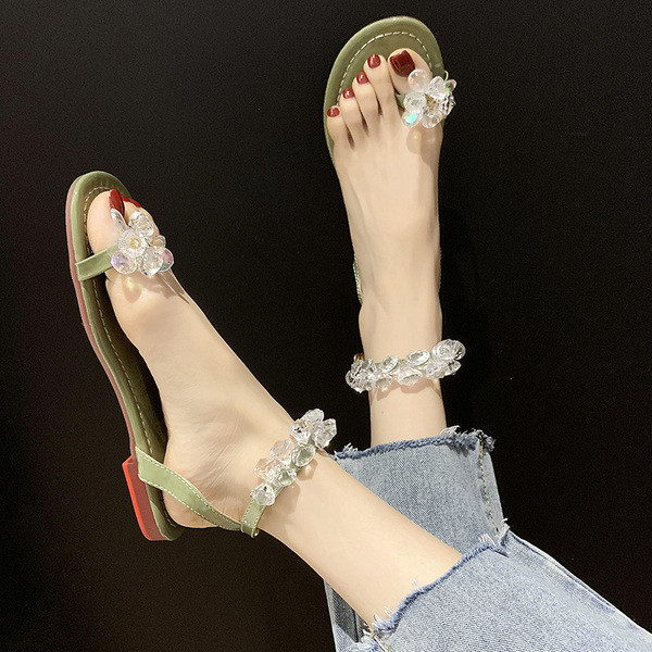 Modernas sieviešu sandales ar zemām zolēm un elementiem-akmeņiem