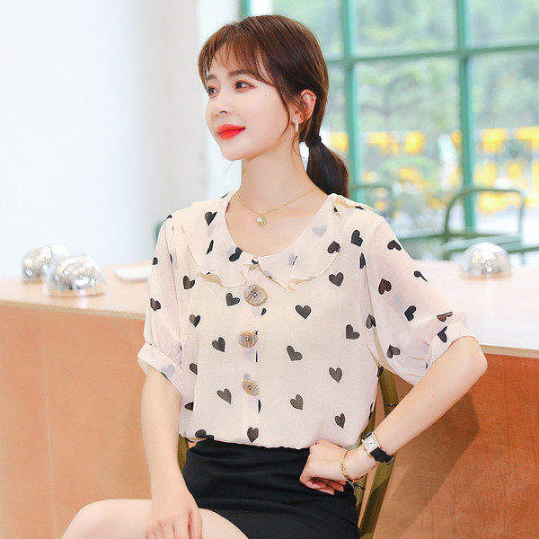 Bēšs sieviešu krekls ar sirsniņu apdruku