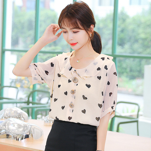 Bēšs sieviešu krekls ar sirsniņu apdruku