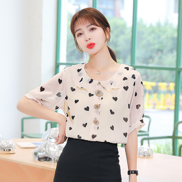 Bēšs sieviešu krekls ar sirsniņu apdruku