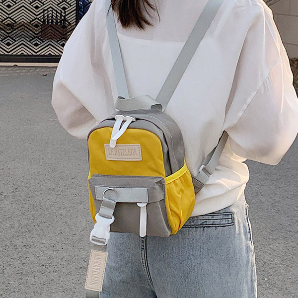 Naiste igapäevane küljetaskutega seljakott