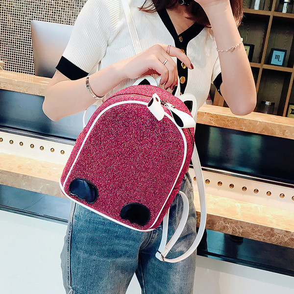 Naiste ajakohane läikiva elemendiga seljakott