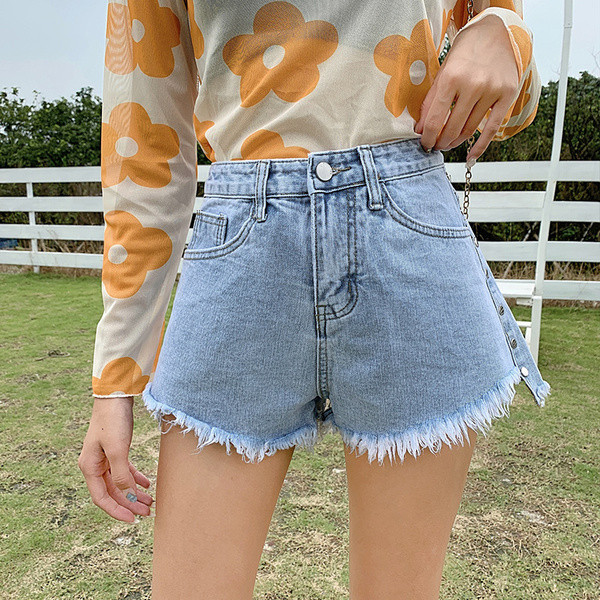 Naiste lühikeste teksade lai mudel kõrge vöökoha ja taskutega