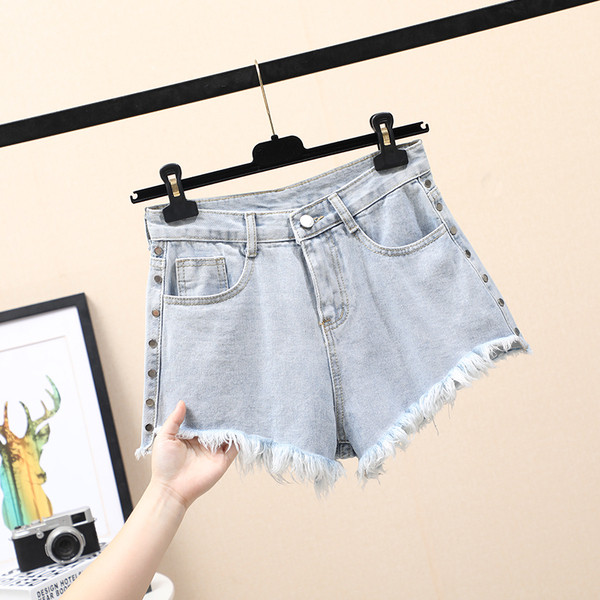 Naiste lühikeste teksade lai mudel kõrge vöökoha ja taskutega