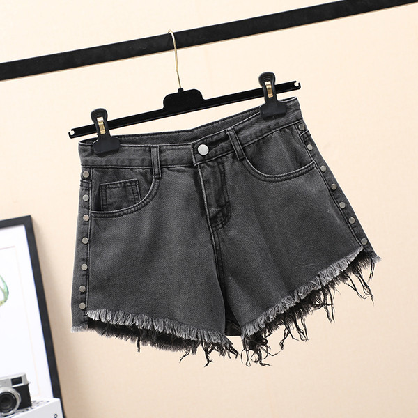 Naiste lühikeste teksade lai mudel kõrge vöökoha ja taskutega