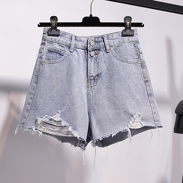 Īsi sieviešu džinsi ar kabatām un saplēstiem motīviem