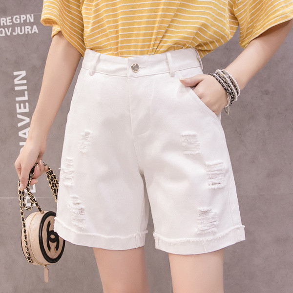 Taskute ja rebenenud motiividega vabaaja lühikesed teksad