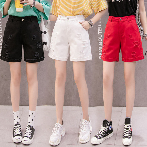 Taskute ja rebenenud motiividega vabaaja lühikesed teksad