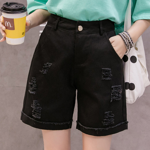 Taskute ja rebenenud motiividega vabaaja lühikesed teksad