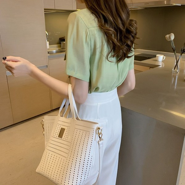 Sieviešu moderns krekls ar īsām piedurknēm un kabatām