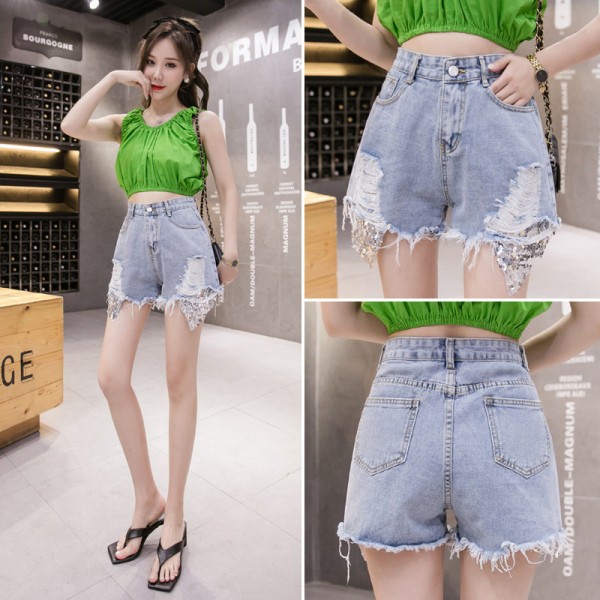 Sieviešu īsie džinsi ar fliteriem un plēstiem motīviem