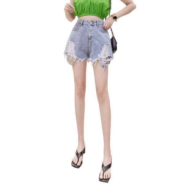 Sieviešu īsie džinsi ar fliteriem un plēstiem motīviem