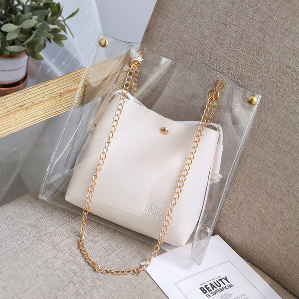 Läbipaistev metallist sangaga naistekott