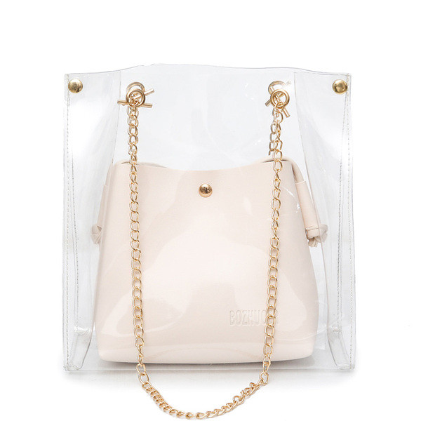 Läbipaistev metallist sangaga naistekott