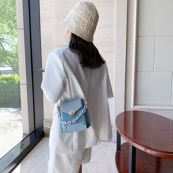 Stiilne naiste metallist elementidega kott ökonahast