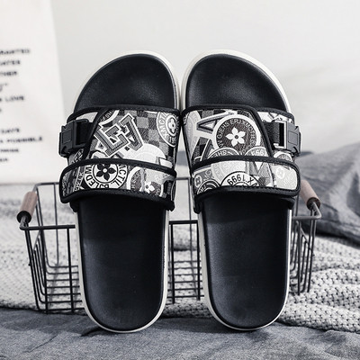 Modernas vīriešu čības ar plakanu zoli un krāsainu rakstu