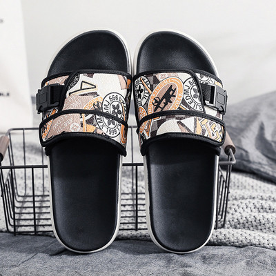 Modernas vīriešu čības ar plakanu zoli un krāsainu rakstu