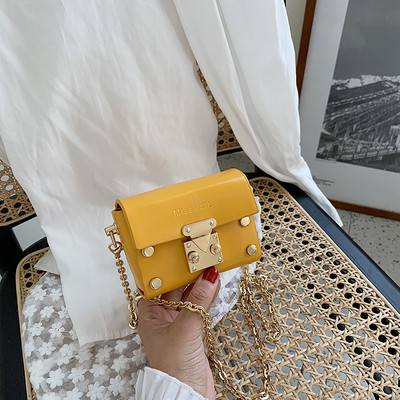 Mini sieviešu soma ar garu rokturi un metāla elementiem