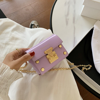 Mini sieviešu soma ar garu rokturi un metāla elementiem