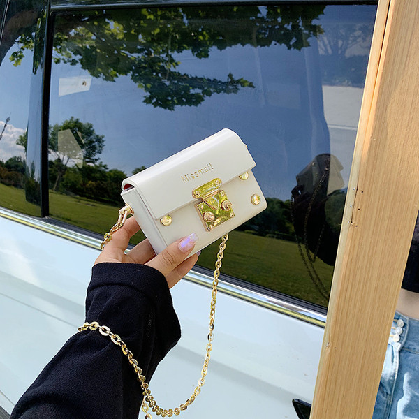 Mini sieviešu soma ar garu rokturi un metāla elementiem