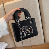 Stílusos női fekete kövekkel díszített táska