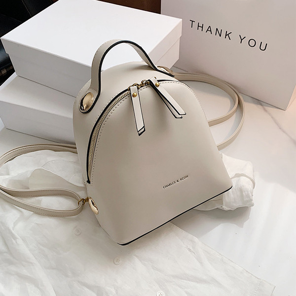 Stilīga sieviešu mugursoma no eko ādas ar uzrakstu