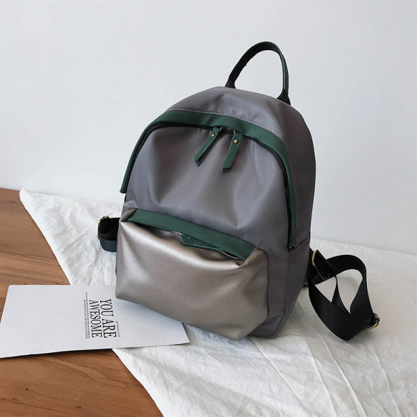 Sieviešu ikdienas mugursomas vienkāršs modelis ar kabatu